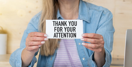Hands hold a card with the text Creative concept Thank You For Your Attentionの写真素材