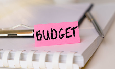 Budget note on agenda and pen, business and office concept background.の写真素材