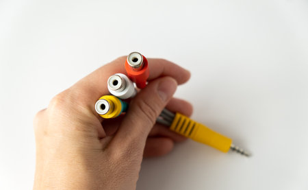 Adapters in hand, connecting and charging gadgets, concept of connecting gadgets
