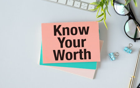 text know your worth on crumpled yellow paper, conceptの写真素材