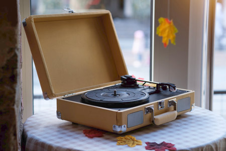 Vintage record player with vinyl records, ray from the sunset