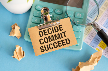 Conceptual hand writing showing Decide Commit Succeed. Business photo text achieving goal comes in three steps Reach your dreams Register pages handwriting text work stationery items woody table.の写真素材