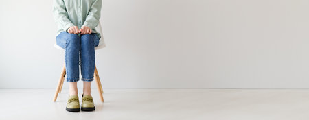 Young woman waiting for interview indoors, copy space, business conceptの写真素材