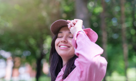 Profile of a relaxed woman breathing fresh air in a green forestの写真素材