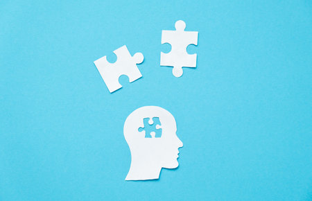 A paper head with a mosaic brain. Dementia. Mental health, concept learning