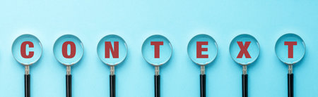Context text message on magnifying glasses on blue background