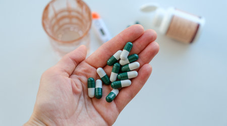 An overhead view of a hand with medicine in it, Medical Concept