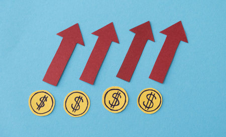 A series of red arrows pointing upward with a dollar sign in the middle. The dollar sign is surrounded by four other dollar signsの写真素材