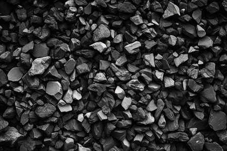 Textured background of black, white, and dark gray volcanic basalt and granite mountain rockの素材