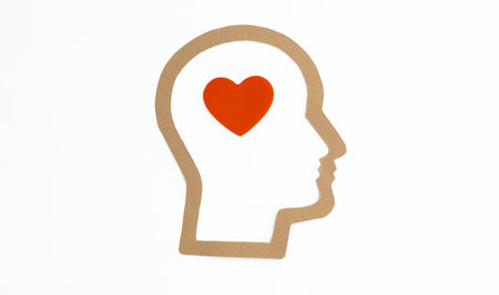 A head with a heart in the middle. The heart is red and the head is white. Concept of love and warmthの写真素材
