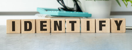 A wooden block with the word Identity written on it. The blocks are arranged in a row, with the letters identy visibleの写真素材