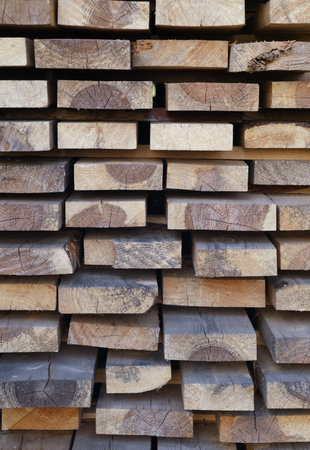 Abstract background of firewood piled in a village, Exterior walls of buildings, vertical photoの写真素材