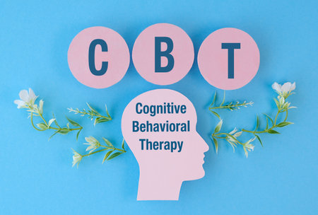 A head with the letters CBT written on it. The head is surrounded by flowers. The flowers are green and whiteの写真素材