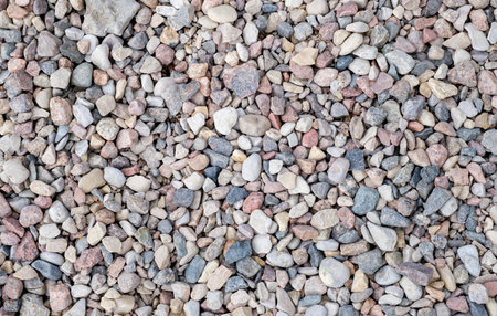 A pile of rocks with a variety of colors. The rocks are scattered and not in a neat pile
