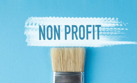 A paintbrush with the word Non Profit written above it. The brush is white and the background is...