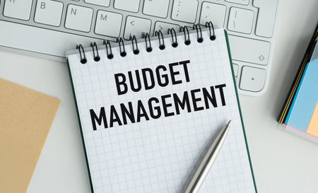 A notebook with the word Budget Management written on it. A pen is sitting on top of the notebookの写真素材