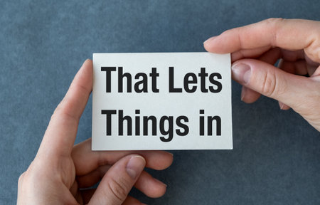 Notebook in hands with Tools and Notes with text That Lets Things in, business conceptの写真素材