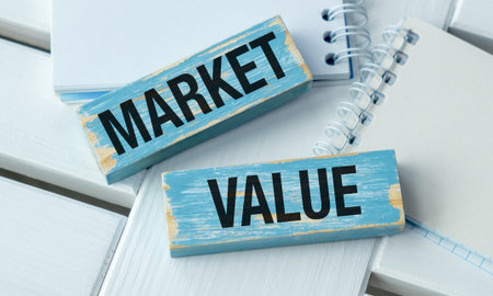 Concept word Market Value on wooden blocks. Business and We are moving concept