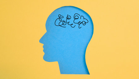 human head profile cut out with healthy brain. Care for good memory, ADHD, Alzheimer, stroke, dementia prevention and world mental health day awareness concept.の写真素材
