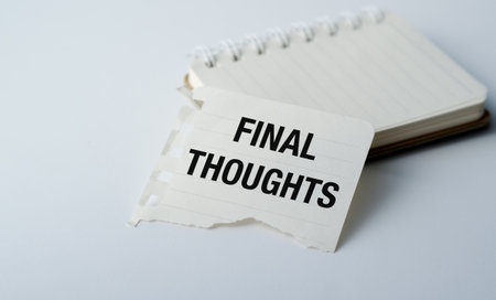 A piece of paper with the words Final Thoughts written on it. The paper is torn and crumpled, giving it a sense of urgency and importanceの写真素材