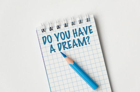 Do You Have a Dream writing on an open notebook with a pencil on with backgroundの写真素材