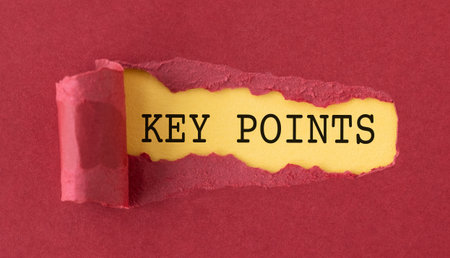 A torn piece of paper with the word Key Points written on it. The paper is red and yellowの写真素材