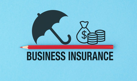 Business Insurance logo with a red pencil and umbrella. The logo is on a blue backgroundの写真素材