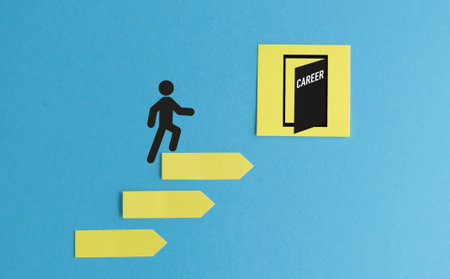 Human icon climbing a ladder made of yellow arrow stickers towards an open door with CAREER text for professional growth and success concept.の写真素材