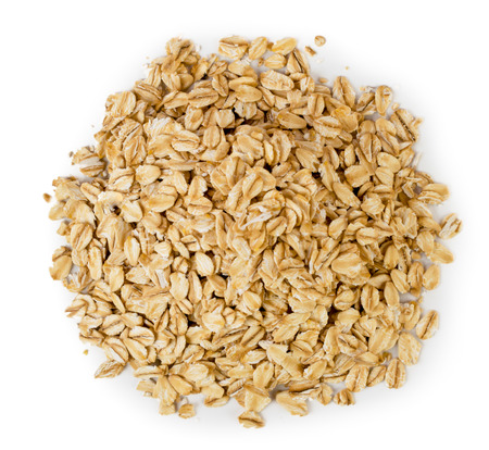 A bunch of oat cereal on a white. The view from the top.
