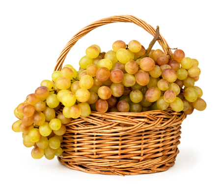 Ripe grapes in a basket close-up on a white. Isolatedの写真素材