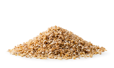 Heap of dry wheat groats on a white background, isolated.の写真素材