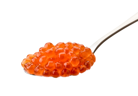 A spoon of salted salmon caviar carved on a white background.の写真素材