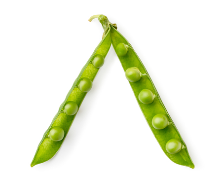 Two halves of green peas on a white. The form of the top.の写真素材