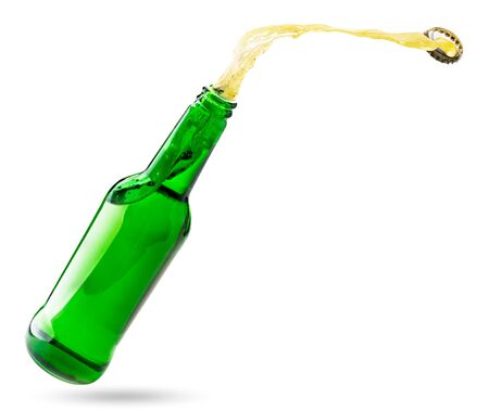 Open bottle with splashes of beer isolated on a white background.の写真素材