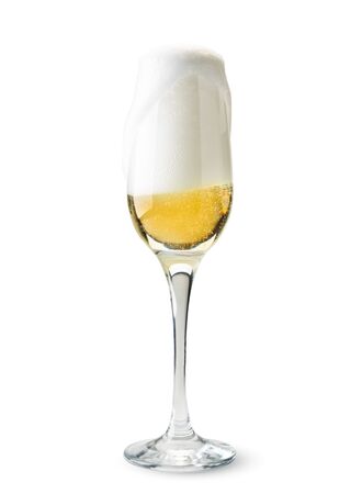 Full glass of champagne, foam pours over the top on a white background. Isolatedの写真素材