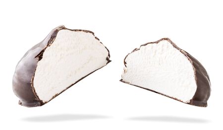 Two halves of marshmallows in chocolate flies on a white.の写真素材