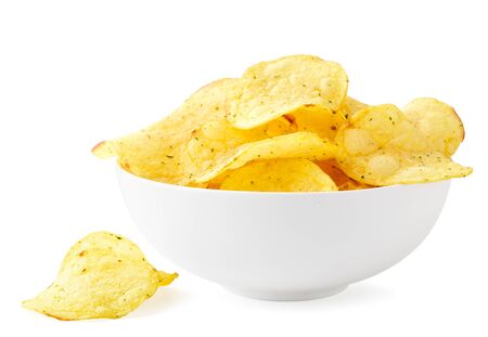 Potato chips with seasonings in a plate and scattered on a white background. Isolatedの写真素材