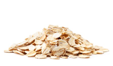 A pile of oatmeal closeup on a white background. Isolatedの写真素材