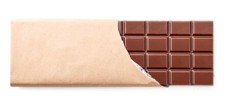 A bar of milk chocolate in a package close-up on a white background isolated. The view from topの写真素材