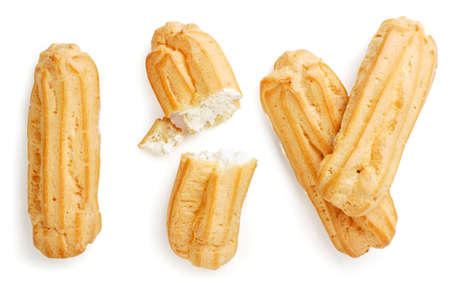 Set of eclairs whole and half close up on a white background, isolated. Top view
