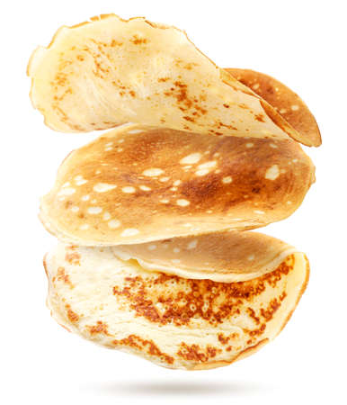 Thin pancakes are flying on a white background. Isolatedの写真素材