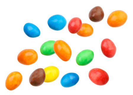 Candy peanuts covered with chocolate in a multicolored glaze fly on a white background. Isolated