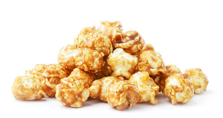Heap of caramelized popcorn close-up on a white plate. Isolatedの写真素材