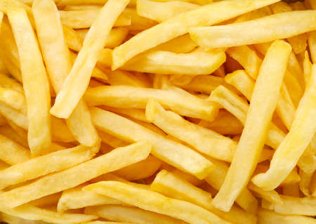 French fries close-up, background. The view of the top
