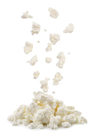 Cottage cheese drops on a heap close-up on a white background. Isolatedの写真素材