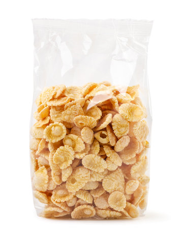 Cornflakes in a transparent package close-up on a white background. Isolated
