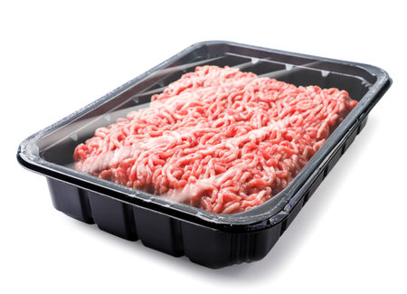 Minced meat in a container close-up on a white background. Isolated