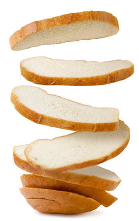 Sliced bread falls on a pile close-up on a white background. isolatedの写真素材