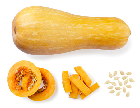 Set of pumpkin, pieces and seeds close-up on a white background. top viewの写真素材