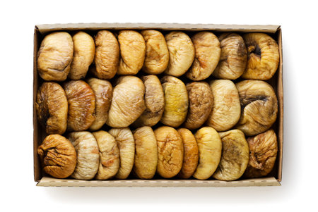 Dried dates in a paper box on a white background. top viewの写真素材